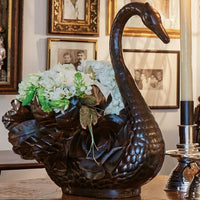 Majestic wax cast iron swan vessel with a bouquet of bustling feathers...artist signed